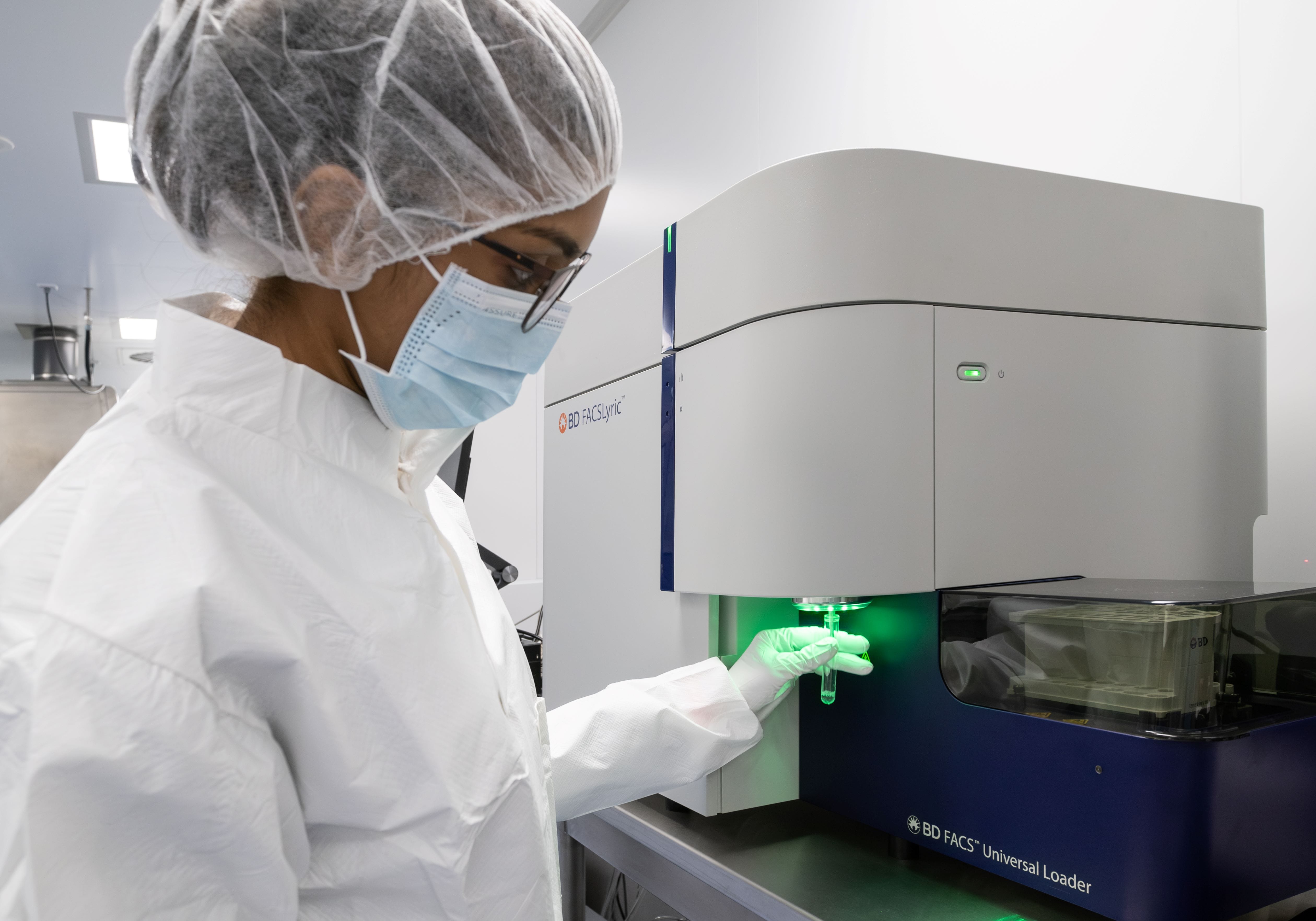 Lab officer operating a lab equipment.